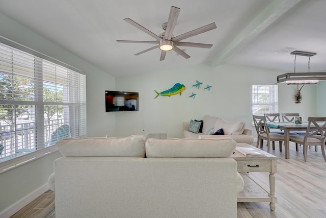 living room with lofted ceiling with beams, ceiling fan, and light hardwood / wood-style floors