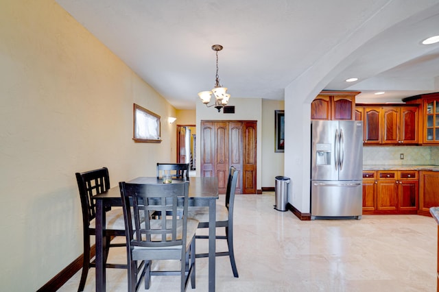 dining area with a chandelier