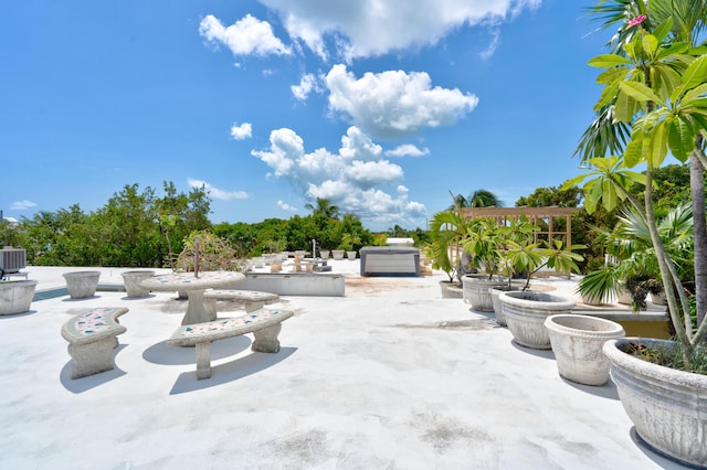 view of patio featuring a jacuzzi