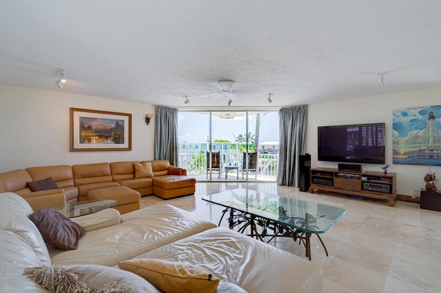 living room with a wall of windows and a textured ceiling