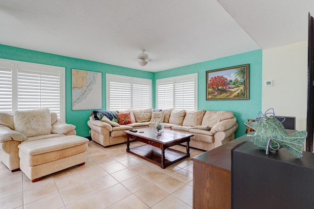 tiled living room with plenty of natural light