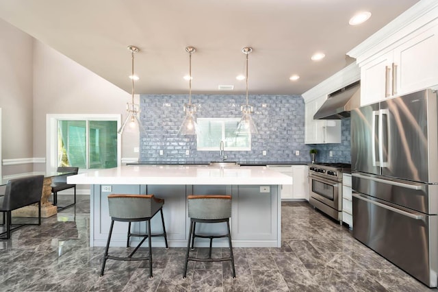 kitchen featuring backsplash, stainless steel appliances, under cabinet range hood, and marble finish floor