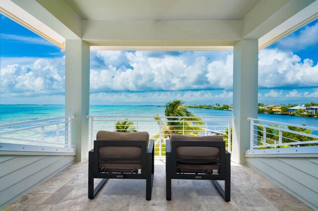 balcony featuring a water view