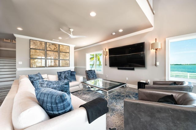living room with stairway, baseboards, ornamental molding, and recessed lighting