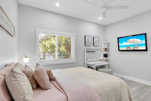 bedroom with ceiling fan and light wood-type flooring