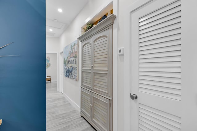 corridor with light hardwood / wood-style flooring