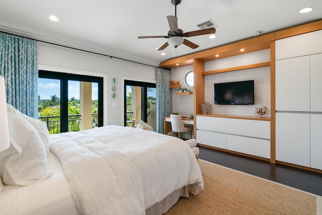 bedroom with access to exterior and dark hardwood / wood-style flooring