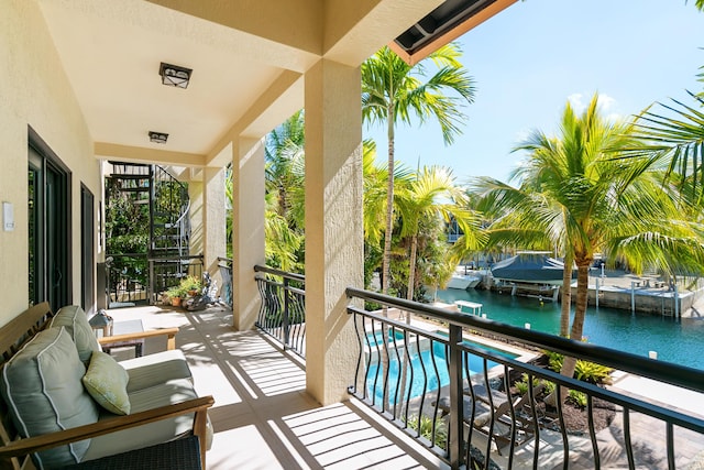 balcony featuring a water view