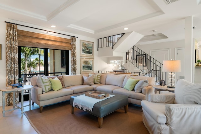 living room featuring a raised ceiling and crown molding