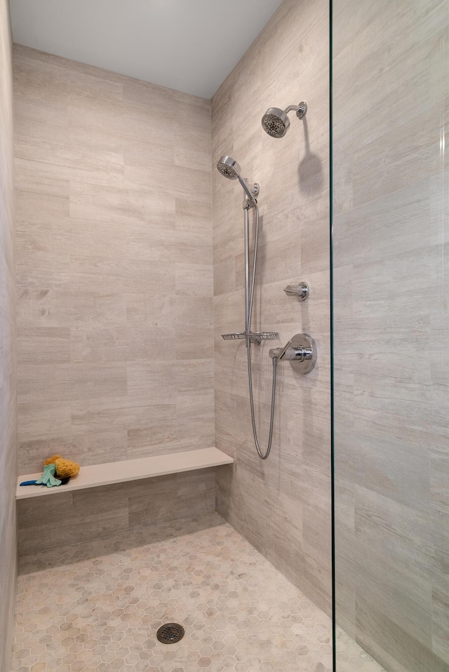 bathroom with a tile shower