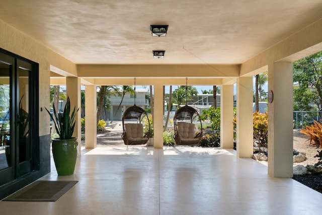 view of patio / terrace with a lanai