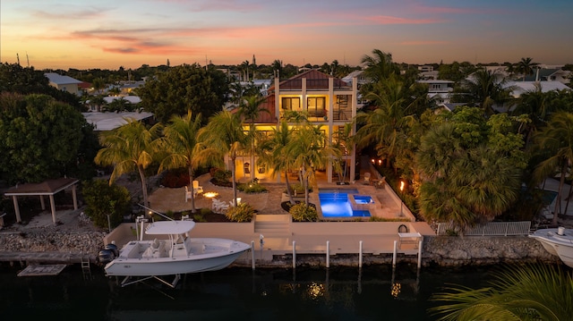 dock area with a balcony and a patio area