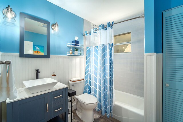 full bathroom featuring vanity, toilet, and shower / bath combo