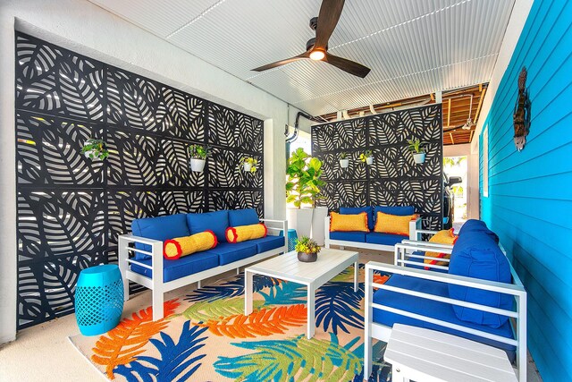 view of patio / terrace featuring ceiling fan and an outdoor living space