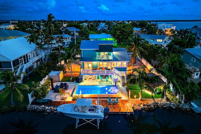 aerial view at dusk with a water view