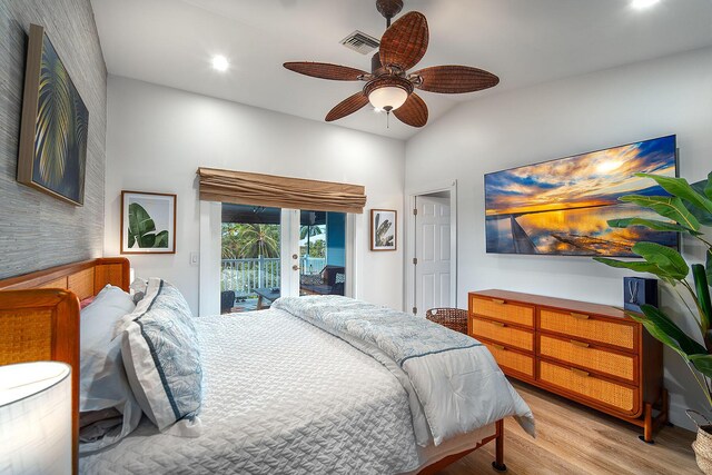 bedroom featuring french doors, ceiling fan, light wood-type flooring, and access to outside