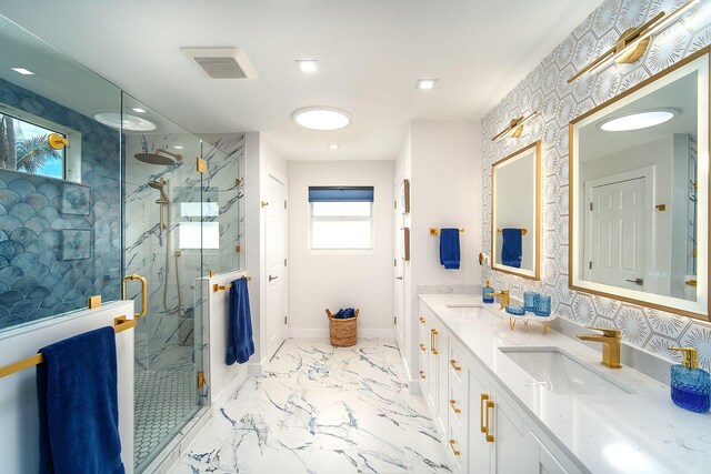 bathroom with vanity and a shower with shower door