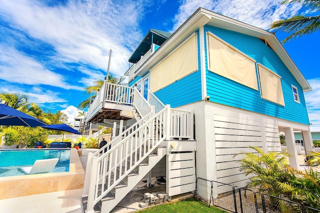 view of side of home with a patio area