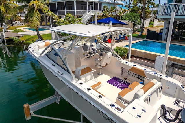 exterior space with a water view and a boat dock