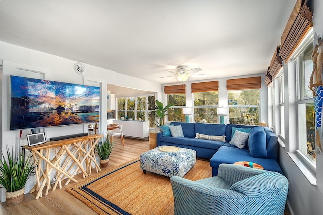 sunroom / solarium with ceiling fan and a healthy amount of sunlight