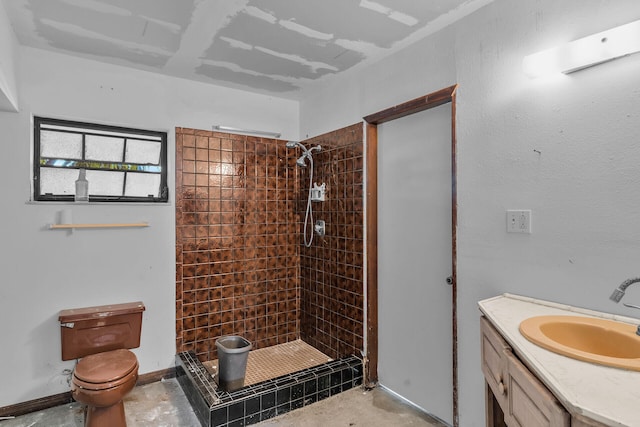 full bathroom with concrete flooring, toilet, vanity, baseboards, and a shower stall