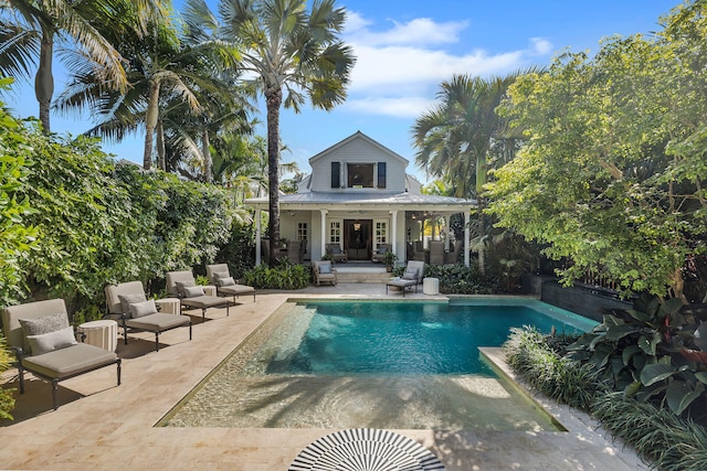 1109 Fleming St, Key West, FL 33040 - back of house with an outdoor pool, an outdoor hangout area, and a patio area