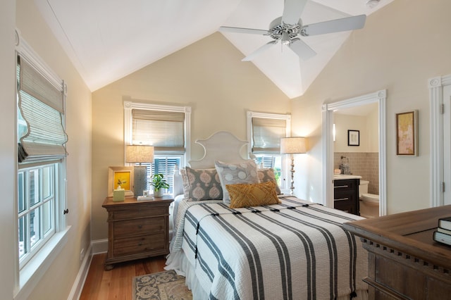 1109 Fleming St, Key West, FL 33040 - bedroom featuring wood finished floors, lofted ceiling, ensuite bathroom, baseboards, and ceiling fan