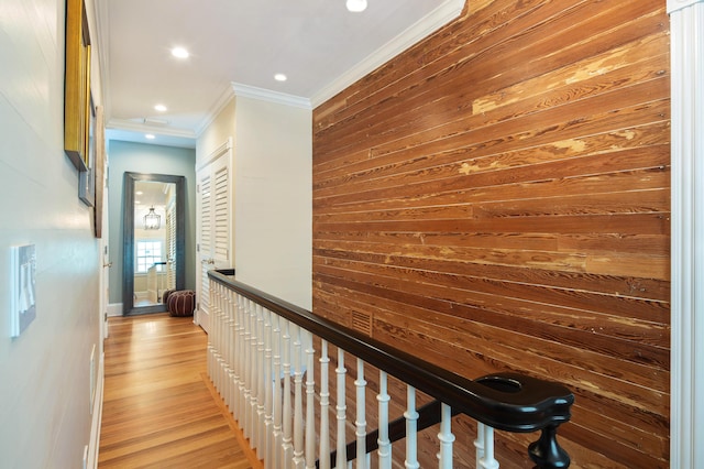 1109 Fleming St, Key West, FL 33040 - corridor featuring an upstairs landing, ornamental molding, wooden walls, recessed lighting, and wood finished floors