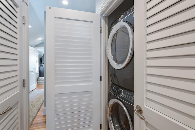 1109 Fleming St, Key West, FL 33040 - laundry room featuring stacked washer / dryer, light wood finished floors, and recessed lighting
