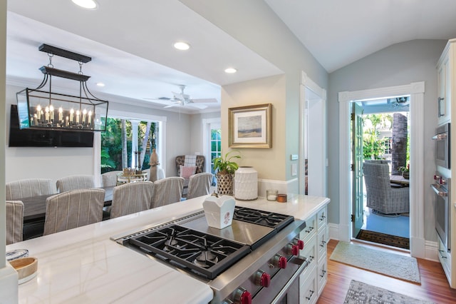 1109 Fleming St, Key West, FL 33040 - kitchen with stainless steel appliances, plenty of natural light, wood finished floors, white cabinetry, and recessed lighting