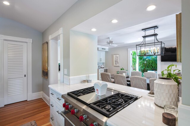1109 Fleming St, Key West, FL 33040 - kitchen with stovetop, a ceiling fan, recessed lighting, light countertops, and white cabinets