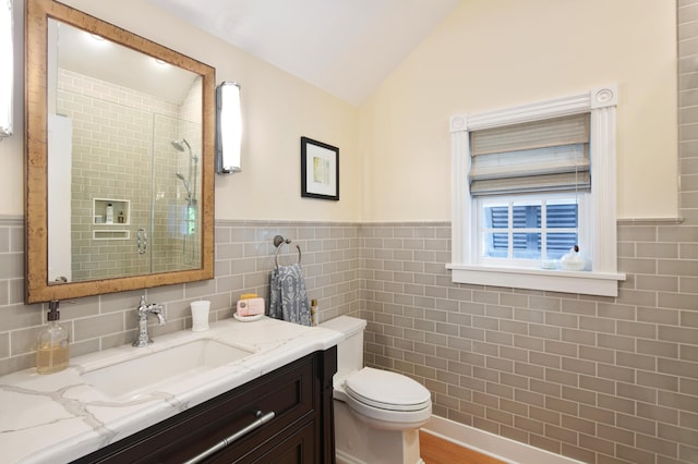 1109 Fleming St, Key West, FL 33040 - bathroom featuring tile walls, tiled shower, lofted ceiling, toilet, and vanity