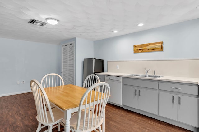 dining area with recessed lighting, visible vents, dark wood finished floors, and baseboards