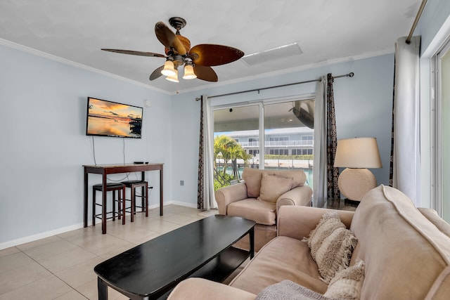 living room featuring ornamental molding, ceiling fan, baseboards, and light tile patterned floors