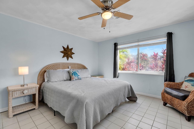 bedroom featuring light tile patterned floors, ceiling fan, and baseboards