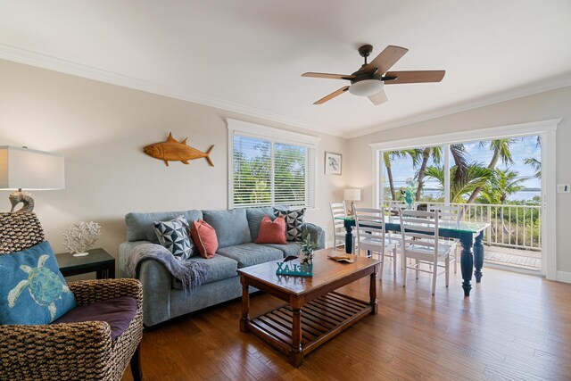 living room featuring crown molding, wood-type flooring, and ceiling fan