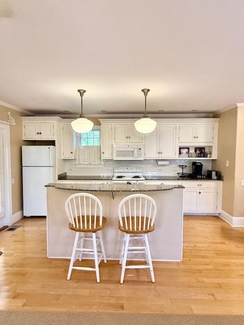 kitchen with light wood-type flooring, white appliances, white cabinets, and crown molding