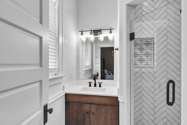 full bathroom with vanity, ensuite bathroom, and a shower stall