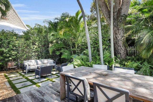 deck featuring an outdoor hangout area and outdoor dining space