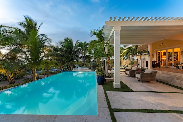 view of swimming pool featuring a pergola, an outdoor hangout area, ceiling fan, and a patio area