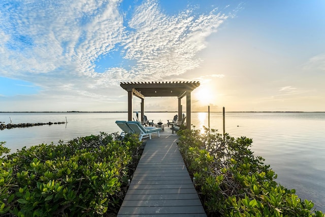 dock area featuring a pergola and a water view