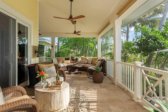 sunroom / solarium featuring vaulted ceiling and ceiling fan