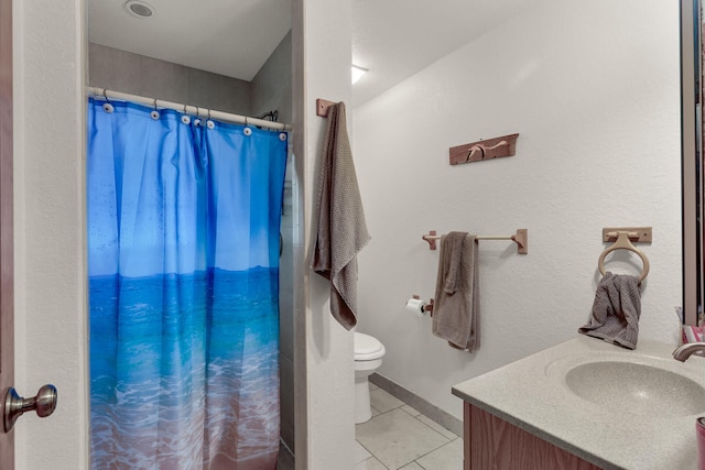 bathroom featuring a shower with shower curtain, vanity, toilet, and tile patterned flooring