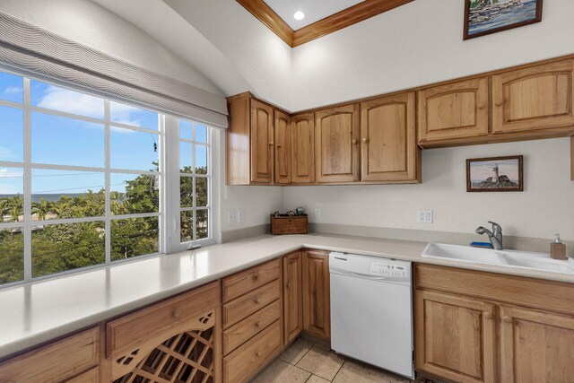 kitchen featuring crown molding, sink, light tile patterned floors, and white dishwasher