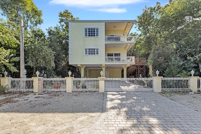 view of front of house featuring a balcony