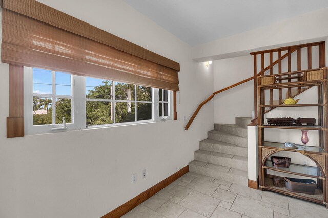 staircase with plenty of natural light