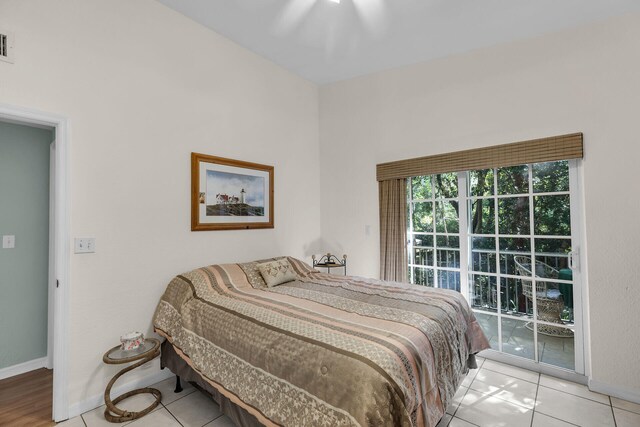 bedroom featuring light tile patterned floors and ceiling fan