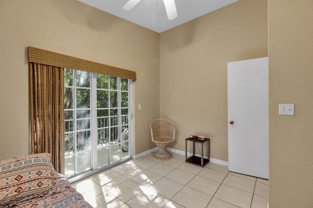 unfurnished room featuring light tile patterned floors and ceiling fan