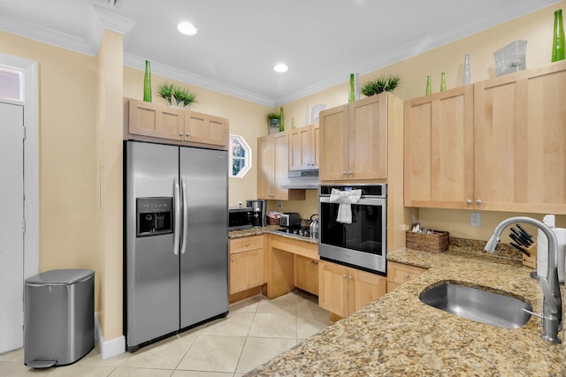 kitchen featuring light brown cabinetry, sink, ornamental molding, stainless steel appliances, and light stone countertops