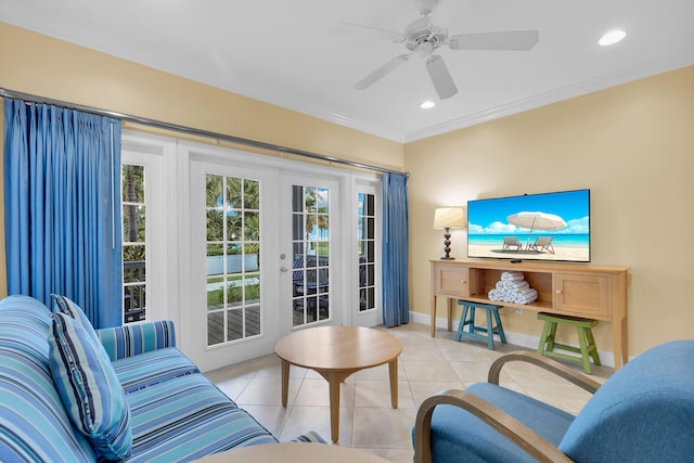 tiled living room with crown molding, plenty of natural light, french doors, and ceiling fan